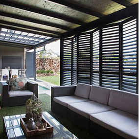 bifold portchester aluminium shutters on open plan conservatory and kitchen