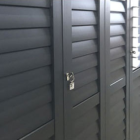 black metal security shutters with lock and key
